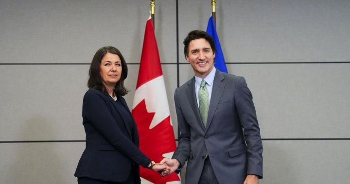 premier-danielle-smith-greets-prime-minister-trudeau-with-awkward-handshake,-grimace